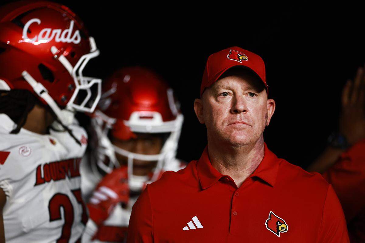 Jeff Brohm, head coach of the Louisville Cardinals, looks on before facing the Miami Hurricanes at Hard Rock Stadium on Oct. 17, 2025 in Miami Gardens, Florida. 