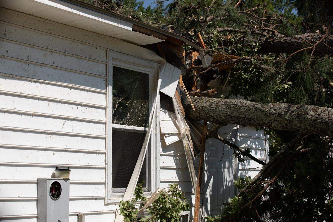 Tornado damage to the exterior of Joy and John Bashore’s house in Rocky Mount, N.C. is shown on Thursday, July 20, 2023. A tornado swept through the area on Wednesday, with several trees falling on the roof of the Bashore’s residence. Joy said she was inside the house with her dog when the tornado hit, and waited in the hallway until the storm passed. Neither Joy nor her dog were injured.