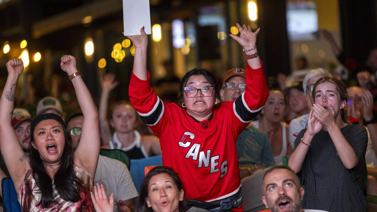 Carolina Hurricanes fans react during a Game 6 Stanley Cup Final watch party in Raleigh's Smoky Hollow district on Sunday, June 14, 2026, as the Hurricanes face the Vegas Golden Knights in Las Vegas.