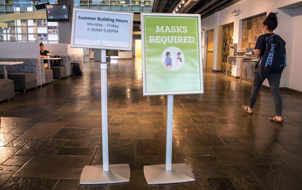 Signs stating that masks are required inside UNC-Chapel Hill’s Carolina Union building can be seen inside the entrance, pictured here on Tuesday, August 3, 2021.