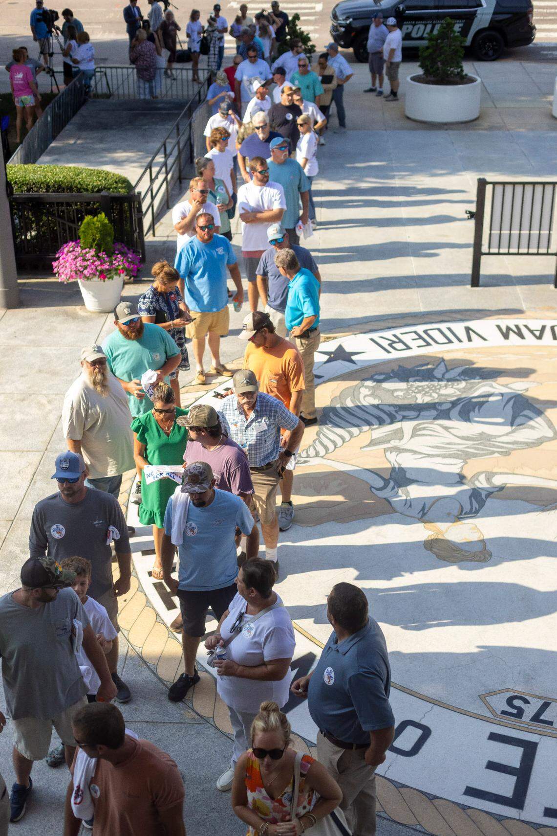 Hundreds of people associated with the fishing industry line up to enter the North Carolina General Assembly in opposition to HB 442, legislation that would prohibit shrimp trawling in all inshore fishing waters and within one-half mile of the shoreline, on Tuesday, June 24, 2025 in Raleigh, N.C.