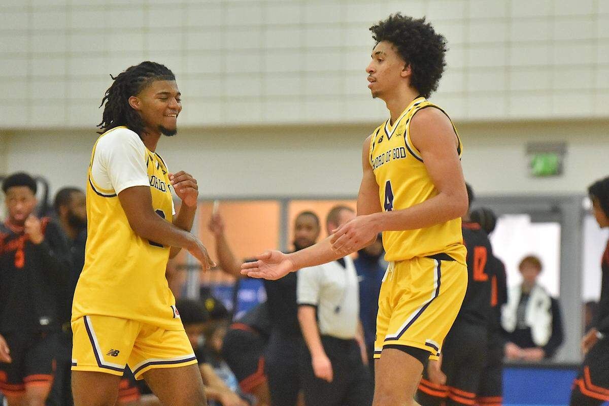 Word of God’s Freddie Dilione (4) celebrates with Mike Best (2) after making the 3 point shot at the end of the second quarterr. The Word of God Holy Rams and the Julius Chambers Cougars met in the John Wall Holiday Classic in Raleigh, N.C. on December 27, 2021