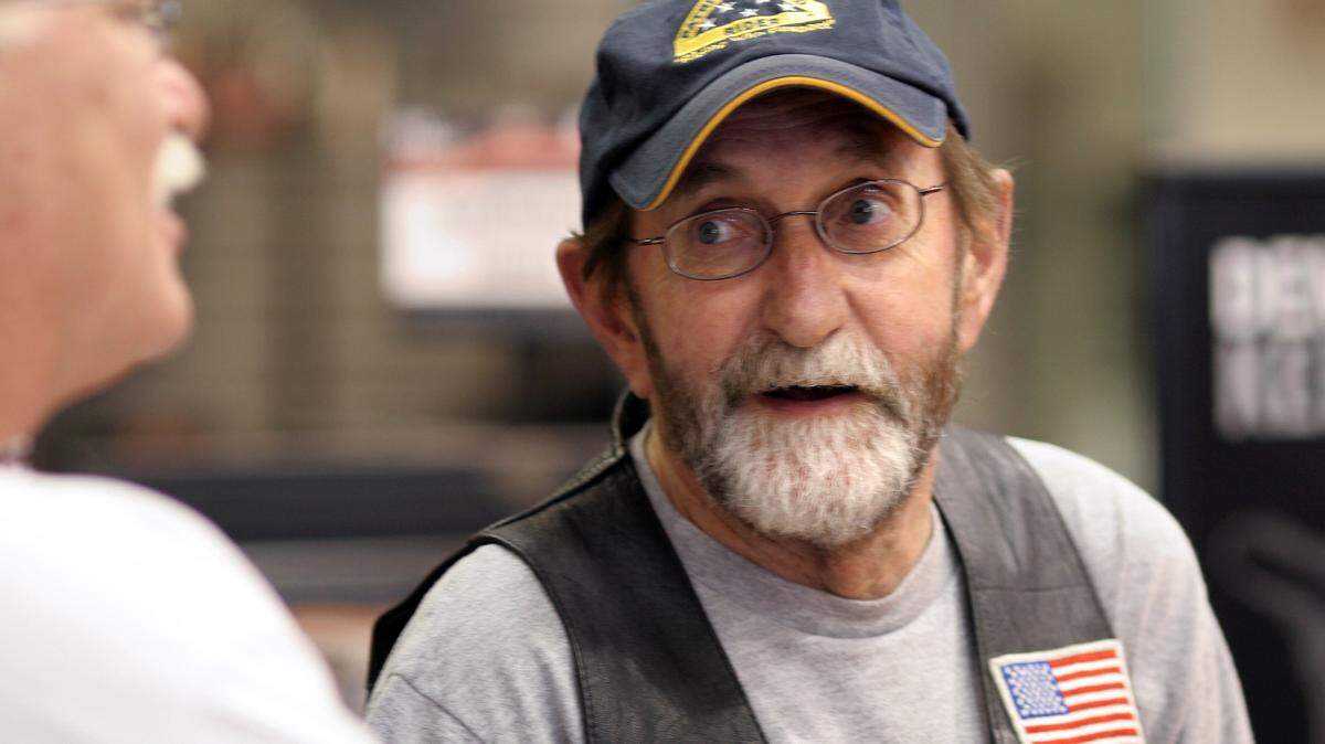 Dennis Rogers relaxes with his friends at Ray Price Harley-Davidson in Raleigh Saturday, June 2, 2007.