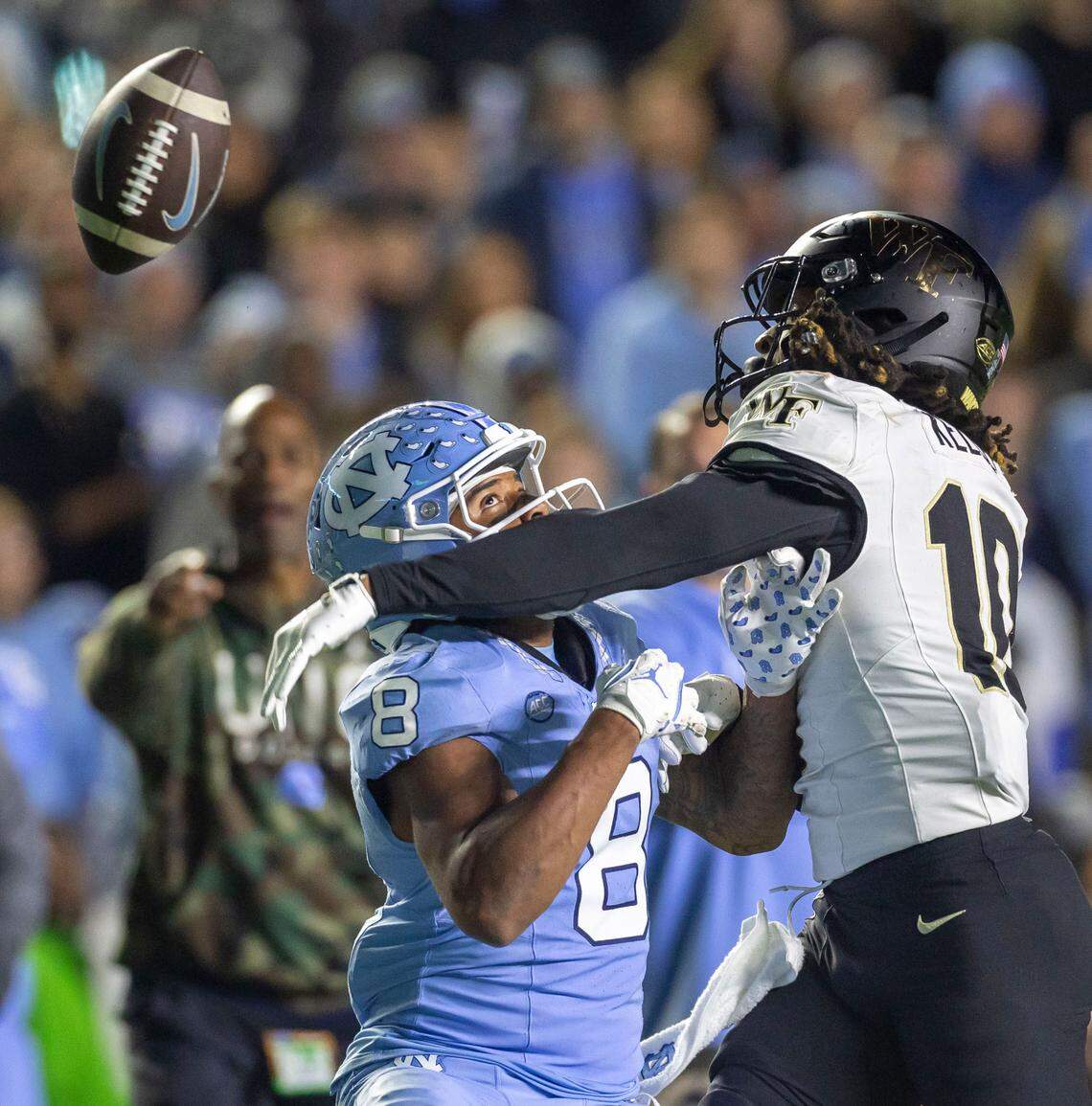 Wake Forest defensive back C’Darius Kelley (10) breaks up a pass intended for North Carolina wide receiver Kobe Paysour (8) in the fourth quarter on Saturday, November 16, 2024 at Kenan Stadium in Chapel Hill, N.C.