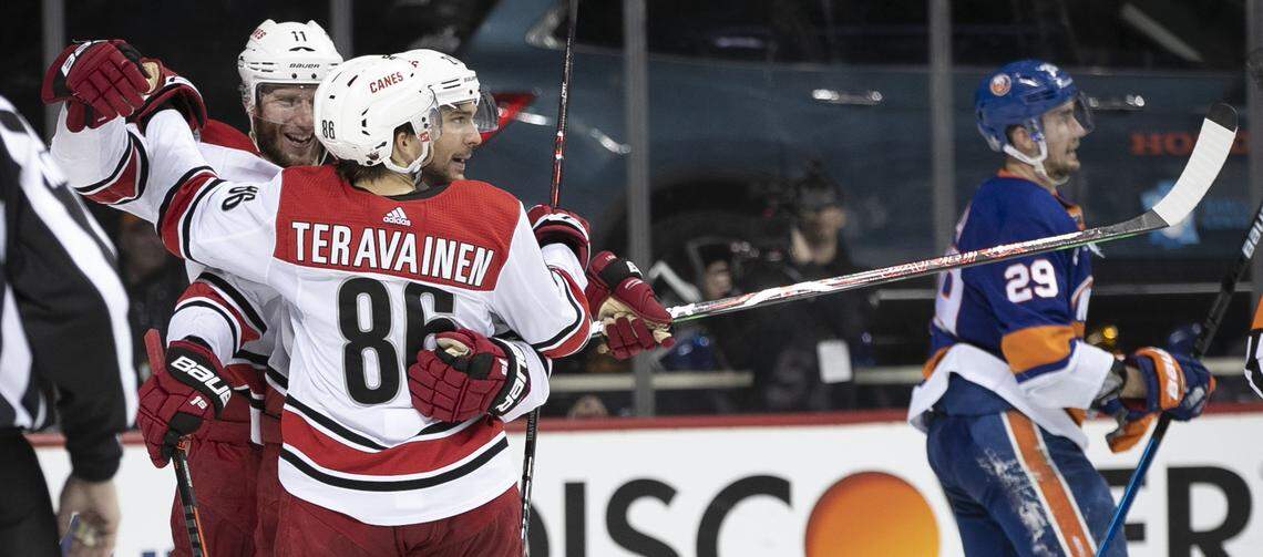 Carolina Hurricanes’ Jordan Staal (11 and Teuvo Teravainen (86) embrace Nino Niederreiter (21) after he scored the game-winning goal on New York Islanders goalie Robin Lehner (40) in the third period during Game 2 of the second round Stanley Cup series on Sunday, April 28, 2019 a Barclays Center in Brooklyn, N.Y. The Hurricanes defeated the Islanders 2-1.
