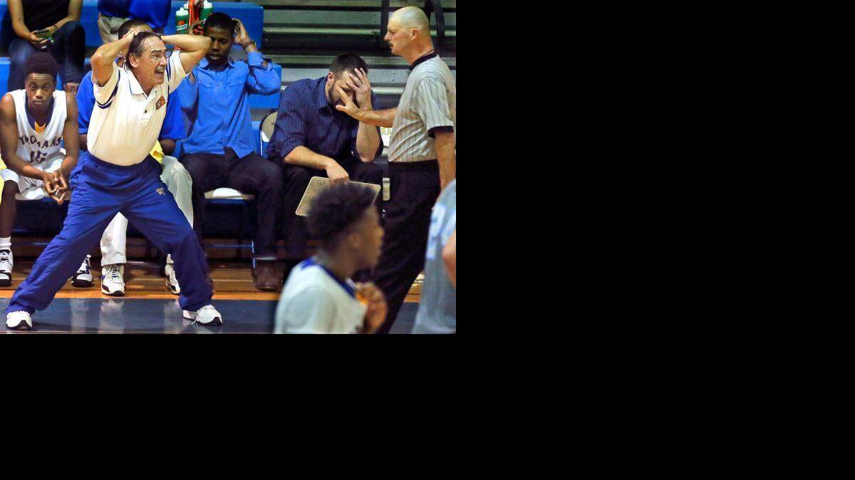 Garner coach Eddie Gray can't seem to believe the referee's call on this play back in November against Cleveland High. The Trojans of Garner High School defeated the Rams of Cleveland High School 109-93.
