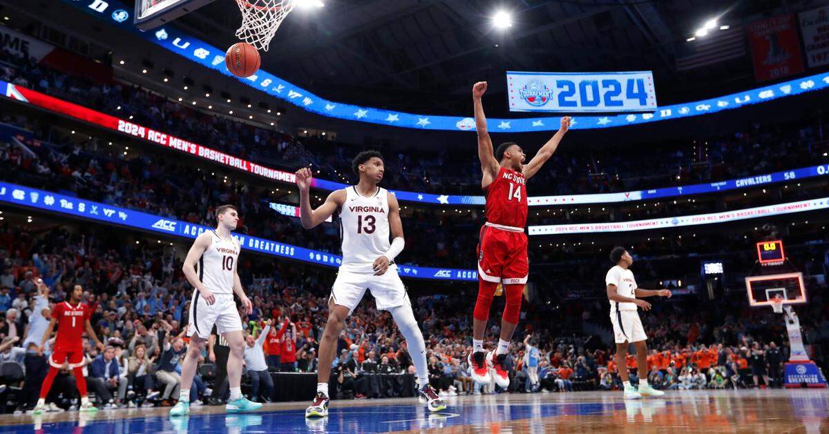 N.C. State’s Casey Morsell (14) celebrates after Michael O’Connell made a buzzer-beat to tie the game at the end of regulation during N.C. State’s 72-65 overtime victory over Virginia in the semifinals of the 2024 ACC Men’s Basketball Tournament at Capital One Arena in Washington, D.C., Friday, March 15, 2024.