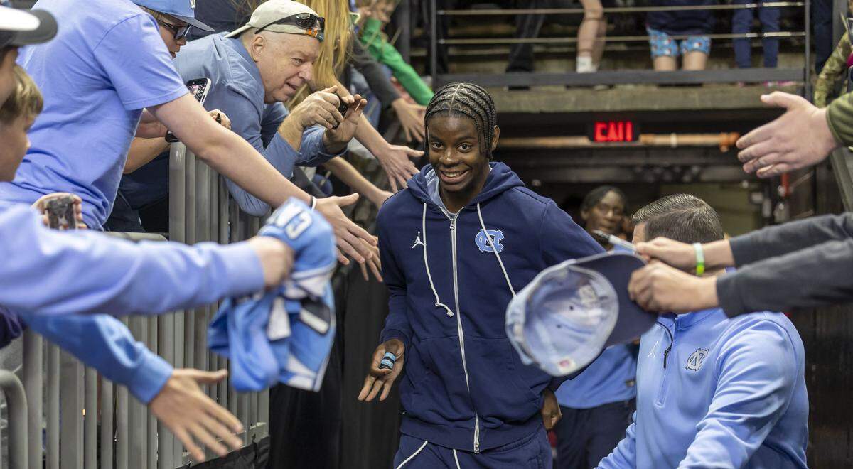North Carolina forward Caleb Wilson, is greeted by fans as he leads the Tar Heels into Bon Secours Arena for their practice on Wednesday, March 18, 2026 in Greenville, S.C.  North Carolina will face VCU in the opening round of the NCAA Tournament without Wilson, as he recovers from a broken thumb. 