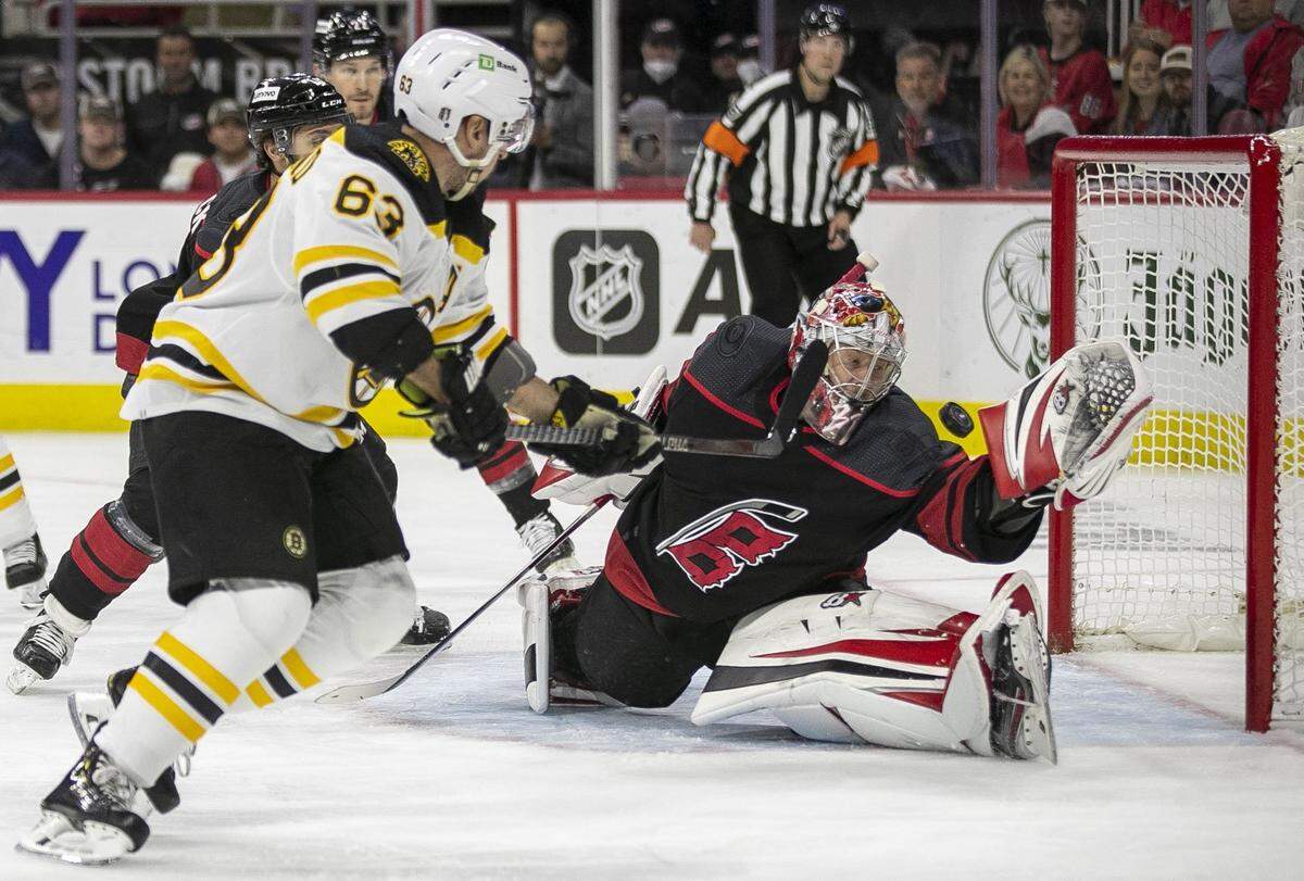 Carolina Hurricanes’ goalie Antii Raanta (32) makes a glove save on a shot by Boston Bruins’ Brad Marchand (63) in the first period on Tuesday, May 10, 2022 during game five of their Stanley Cup first round series at PNC Arena in Raleigh, N.C.