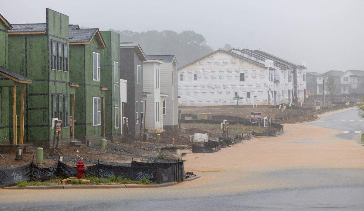 Storm runoff caused by heavy rain from Tropical Storm Chantal floods Parkland Drive in the Chatham Park development on Sunday, July 6, 2025 in Pittsboro, N.C.