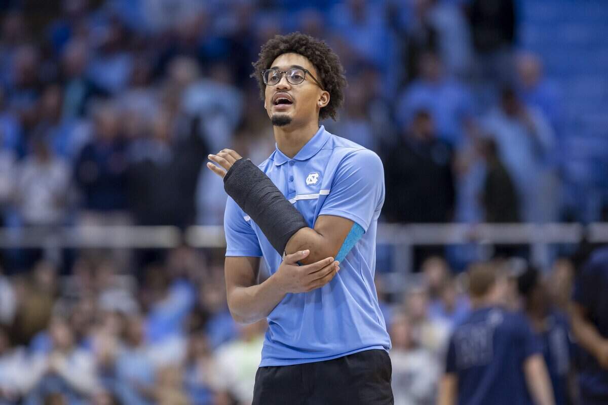 North Carolina guard Seth Trimble, out after breaking a bone in his left arm, encourages his teammates during the Tar Heels’ pre-game warm ups ahead of their game against Navy on Tuesday, November 18, 2025 at the Smith Center in Chapel Hill, N.C.