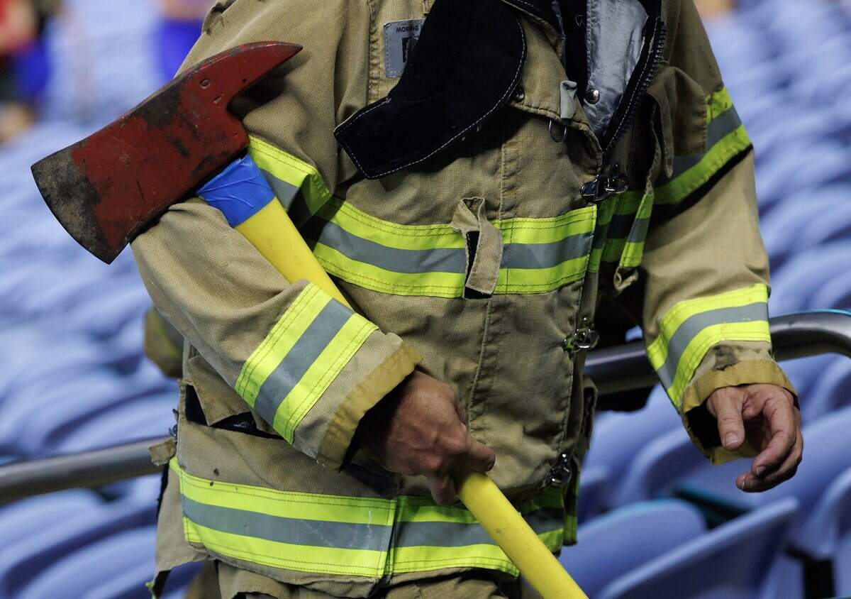 A participant climbs the stairs of Kenan Memorial Stadium during an event in Chapel Hill, N.C. on Thursday, Sept. 11, 2025, to honor those who lost their lives during attacks of Sept. 11, 2001.