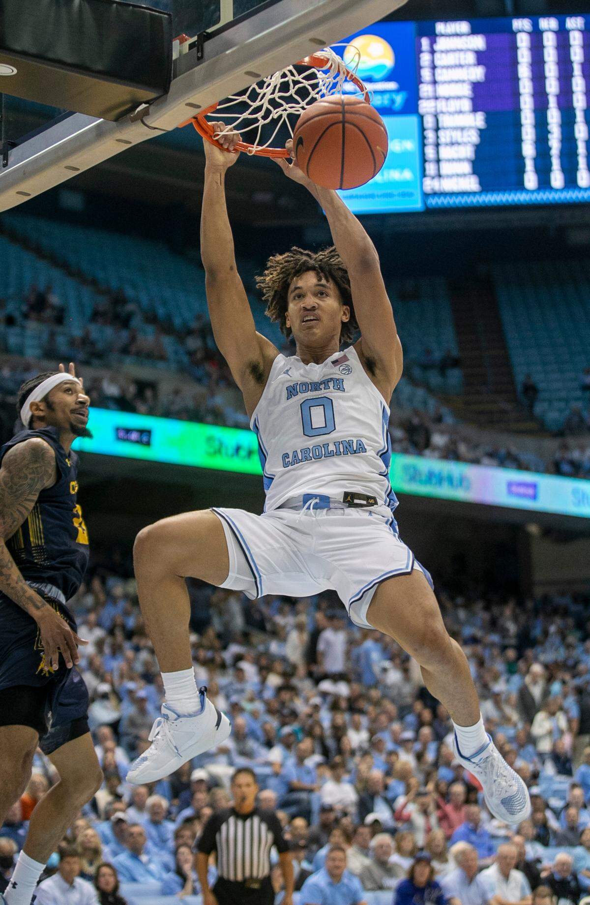 North Carolina’s Seth Trimble (0) drives to the basket for a dunk against Johnson C. Smith’s Nilous Hodge Jr. (21) in the first half during an exhibition game on Friday, October 28, 2022 at the Smith Center in Chapel Hill, N.