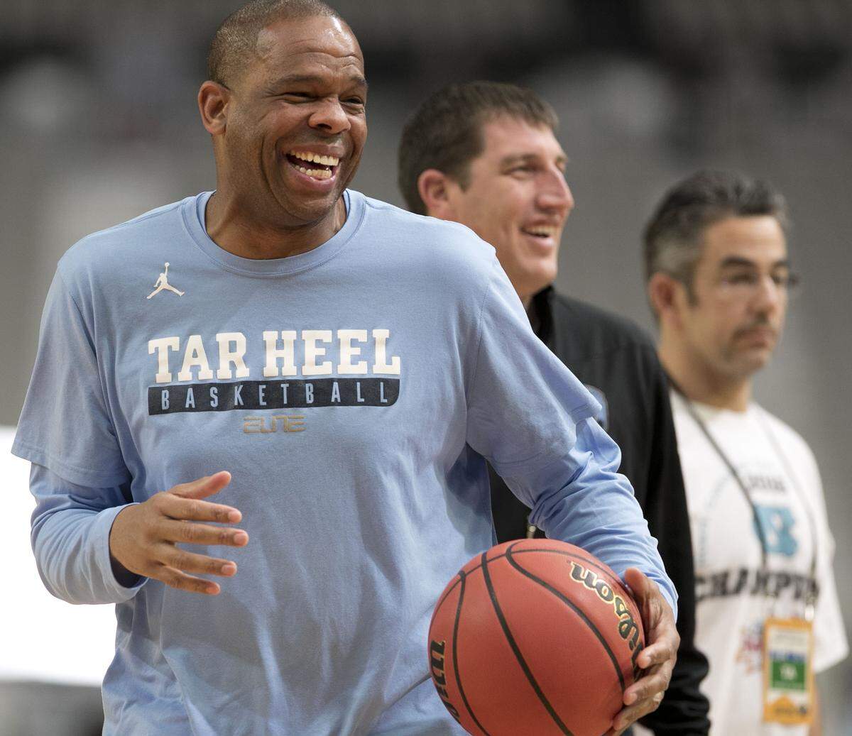 North Carolina assistant coach Hubert Davis laughs with the players as the Tar Heels practiced on Friday, March 31, 2017 at the University of Phoenix Stadium in Glendale, Arizona.