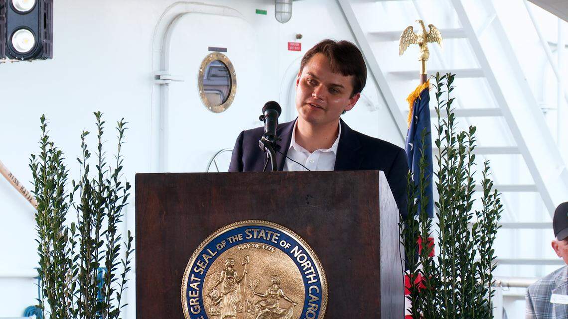 Jordan Hennessy at the christening ceremony for the Miss Katie dredge. Hennessy is a former legislative aide who now oversees the dredge’s operations.