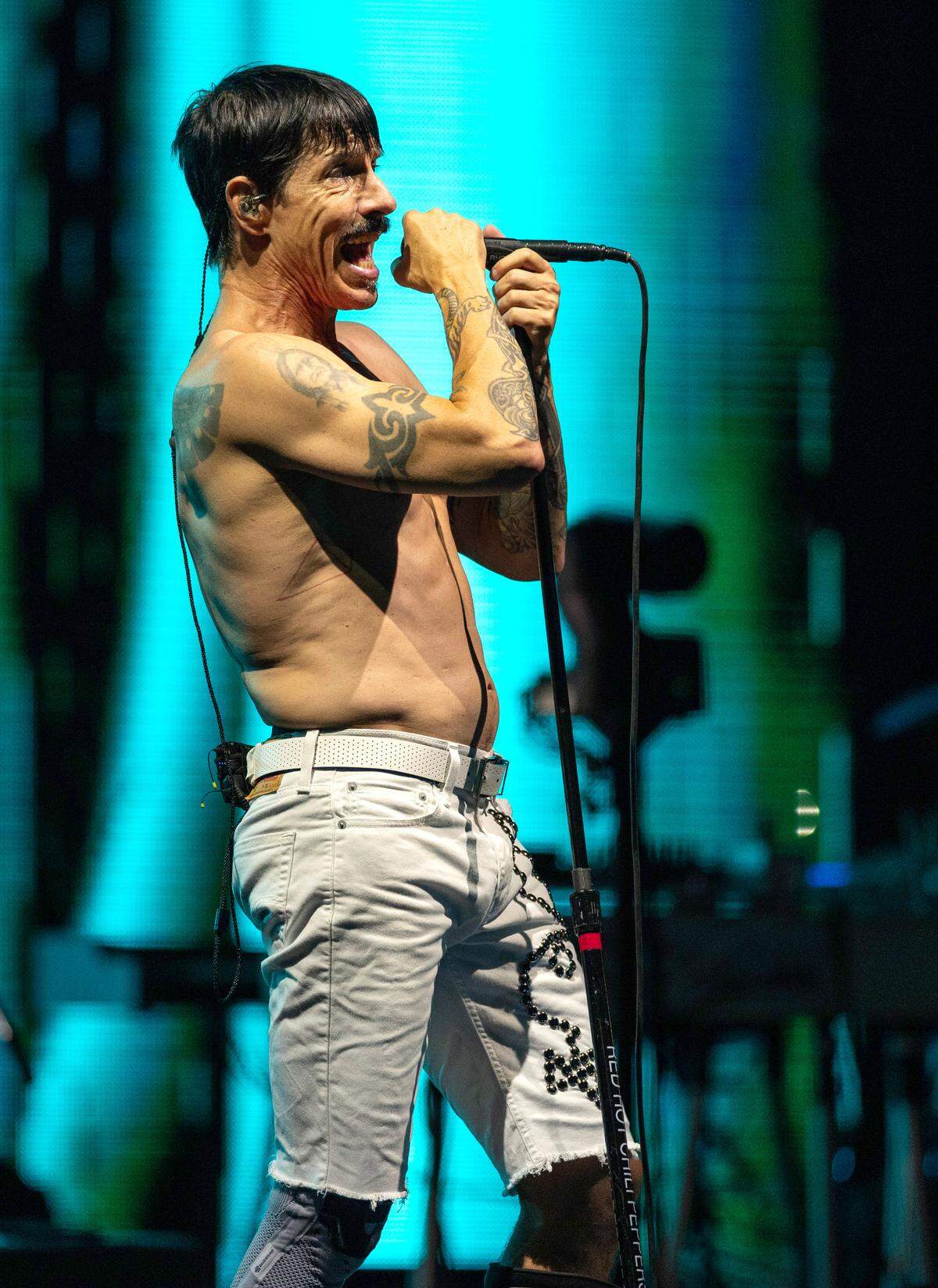 Lead singer Anthony Kiedis pours out his powerful vocals as Red Hot Chili Peppers play Raleigh’s Coastal Credit Union Music Park at Walnut Creek, Wednesday, June 26, 2024.