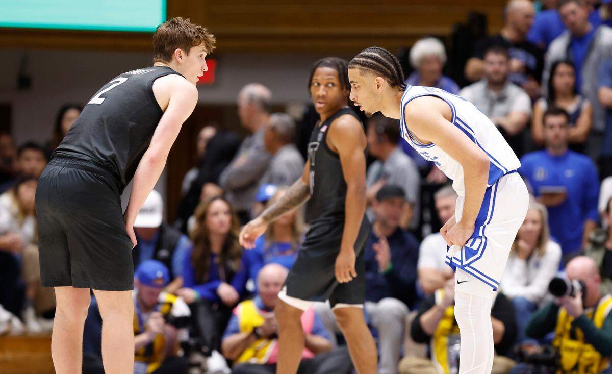 Duke’s Tyrese Proctor (5) keeps his eye on Virginia Tech’s Jaden Schutt (2) during the first half of Duke’s game against Virginia Tech at Cameron Indoor Stadium in Durham, N.C., Tuesday, Dec. 31, 2024.