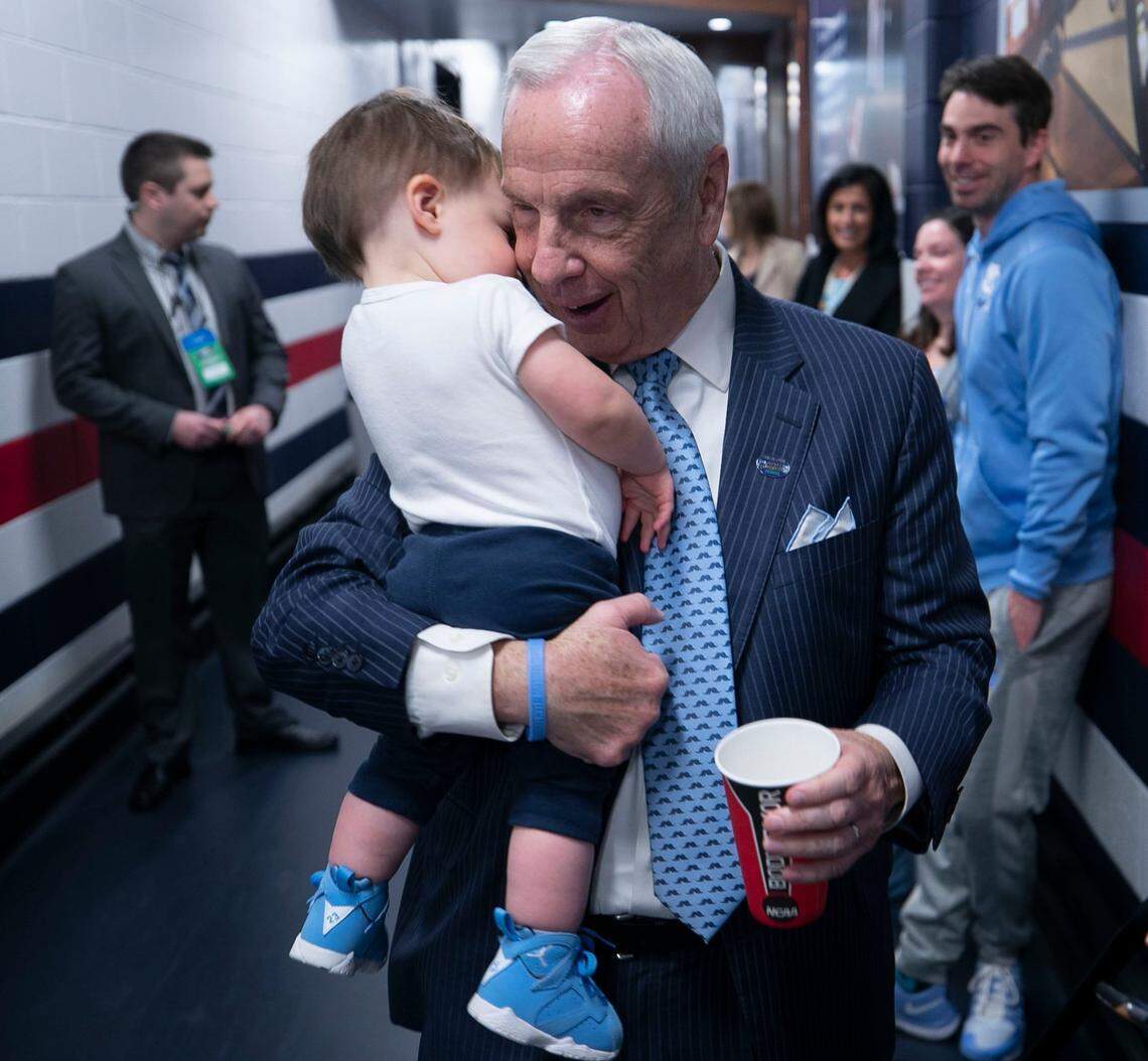 North Carolina coach Roy Williams cuddles with his grandson, one-year-old Kayson Newlin, outside the Tar Heels’ locker room following North Carolina’s 81-59 victory over Washington in the second round of the NCAA Tournament on Sunday, March 24, 2019 at Nationwide Arena in Columbus, Ohio.
