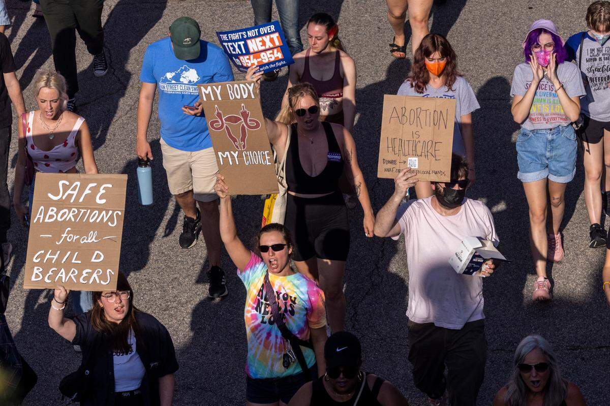 Hundreds of demonstrators rally and march in downtown Raleigh Friday, June, 24, 2022 in opposition to the U.S. Supreme Court’s decision to overturn its landmark Roe v. Wade ruling.