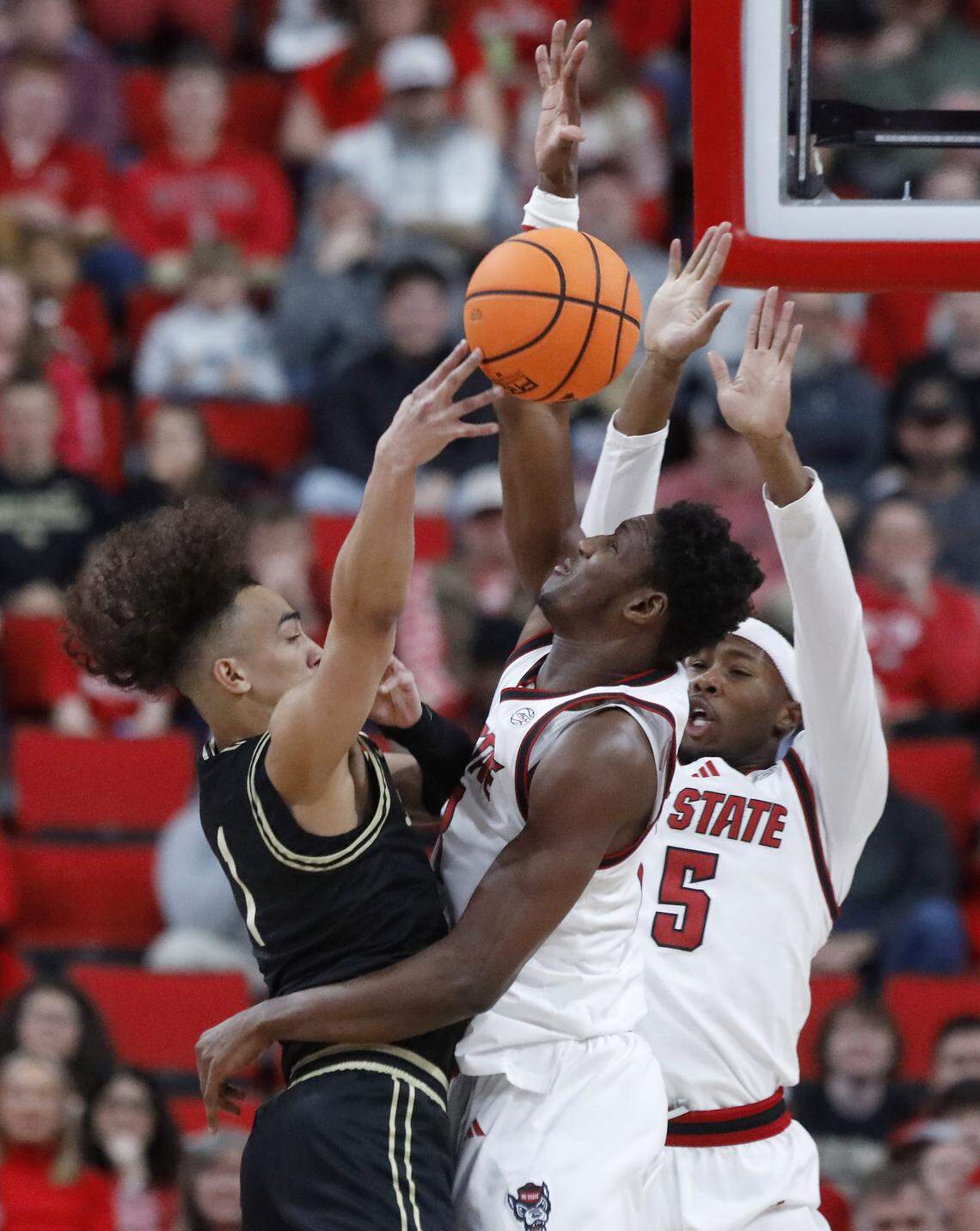 N.C. State’s Musa Sagnia pressures Wake Forest’s Nate Calmese during the first half of the Wolfpack’s 70-57 win on Wednesday, Dec. 31, 2025, at Lenovo Center in Raleigh, N.C.