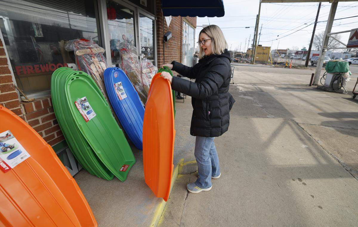 Amy Leden of Raleigh purchased three plastic sleds and a Flexible Flyer wooden sled at Smith Hardware and Garden in Raleigh Friday morning. By 10:55 a.m., the store had sold out of sleds.