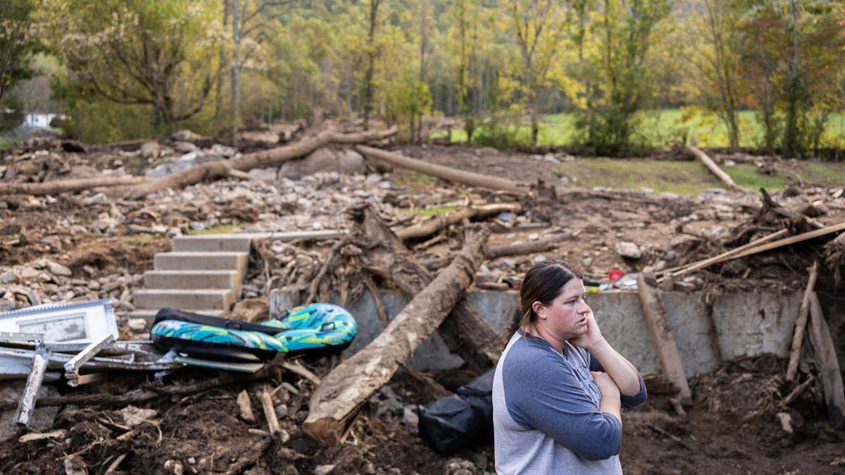 They were in the basement frantically preparing for a flood. Then the landslide hit.