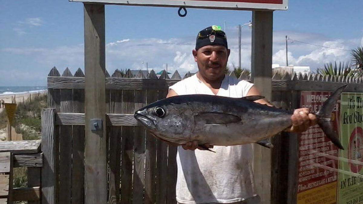 Maurillo Marquez of  Cary, N.C. holds a 21-pound, 12-ounce blackfin tuna, a fish that is now active in offshore waters.