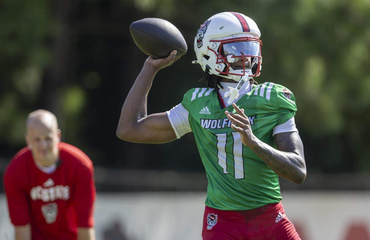 N.C. State quarterback C.J. Bailey (11) looks for a receiver during the Wolfpack’s practice on Tuesday, July 30, 2025 in Raleigh, N.C.