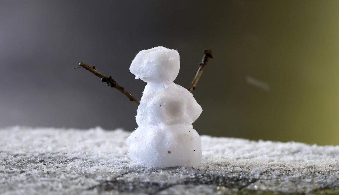 Enough snow fell Monday, Dec. 8 in downtown Raleigh for someone to make this small snowman sitting on a table.