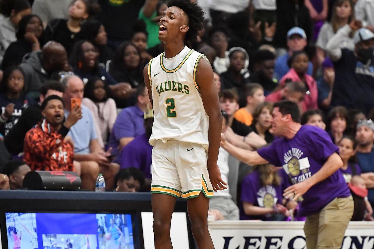Richmond’s Paul McNeil (2) celebrates after making the last second three-point shot at the end of the first quarter. The Richmond Raiders and the Holly Springs Golden Hawks met in the NCHSAA 4A East Regional Finals in Sanford, N.C. on March 4, 2023.
