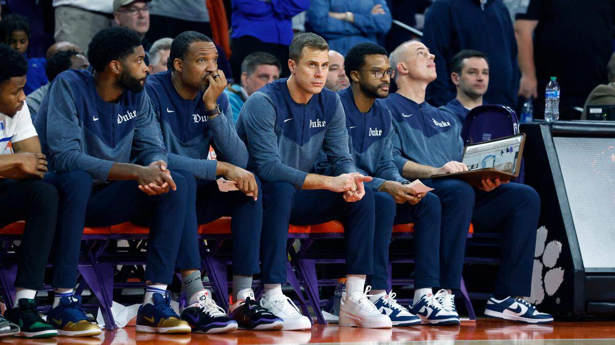 From left, Duke assistant coach Amile Jefferson, associate head coach Chris Carrawell, head coach Jon Scheyer, assistant coach Jai Lucas and special assistant to the head coach Mike Schrage watch late in the second half of Clemson’s 72-64 victory over Duke at Littlejohn Coliseum in Clemson, S.C., Saturday, Jan. 14, 2023.