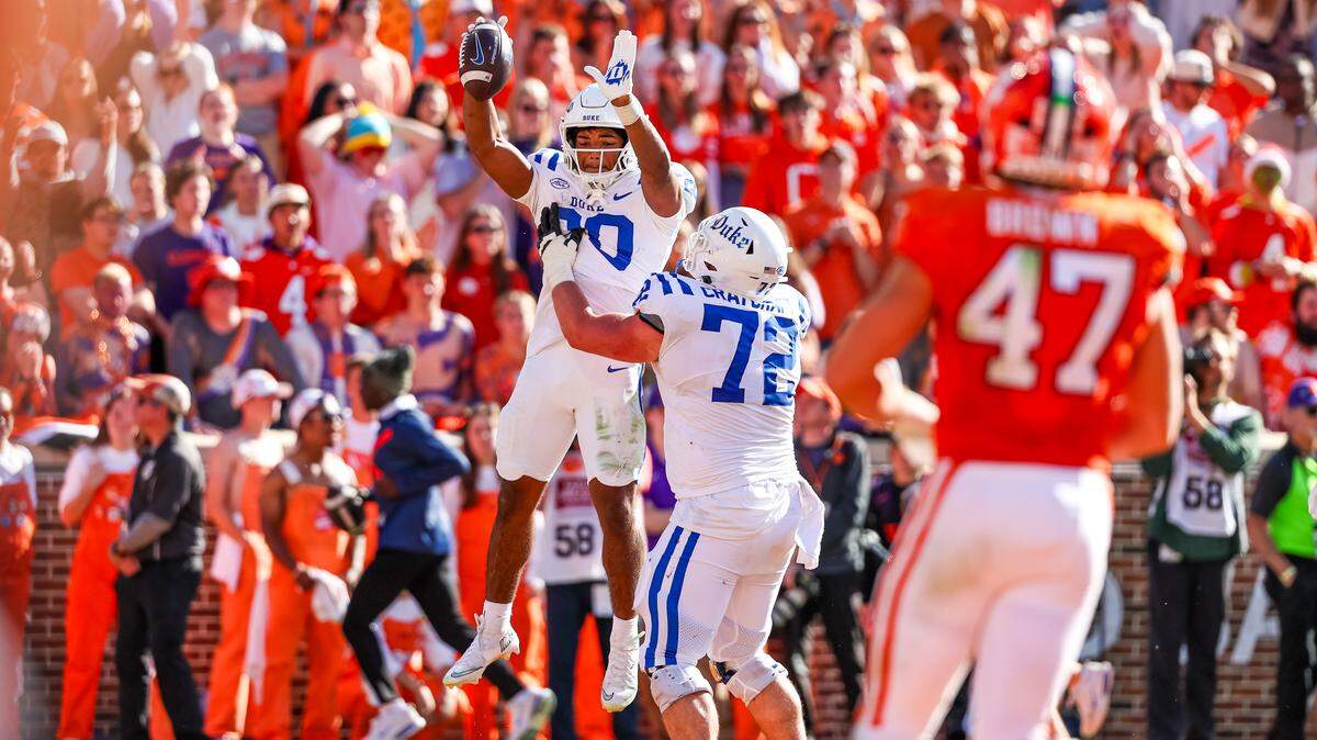 Nate Sheppard (20) and Matt Craycraft (72) of the Duke Blue Devils celebrate after a touchdown during the second half of a football game against the Clemson Tigers at Memorial Stadium on November 01, 2025 in Clemson, South Carolina.