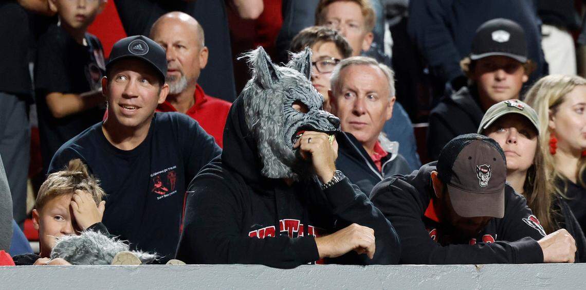 Wolfpack fans watch during the second half of Louisville’s 13-10 victory over N.C. State at Carter-Finley Stadium in Raleigh, N.C., Friday, Sept. 29, 2023.
