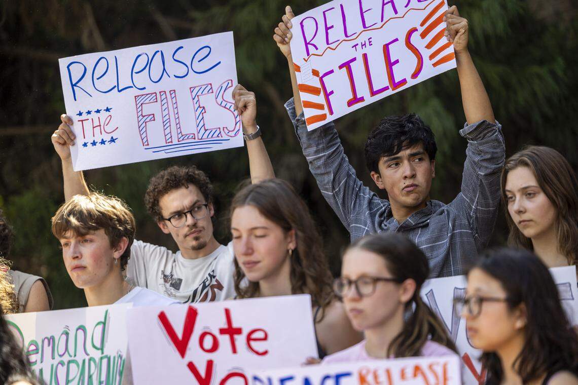UNC-Chapel Hill students and faculty hold signs during a press conference Friday, April 17, 2026, outside Banks D. Kerr Hall on campus prior to a Faculty Council meeting. The group urges Chancellor Lee Roberts to release the $1.2 million SCiLL investigation, citing transparency, public records and campus accountability.