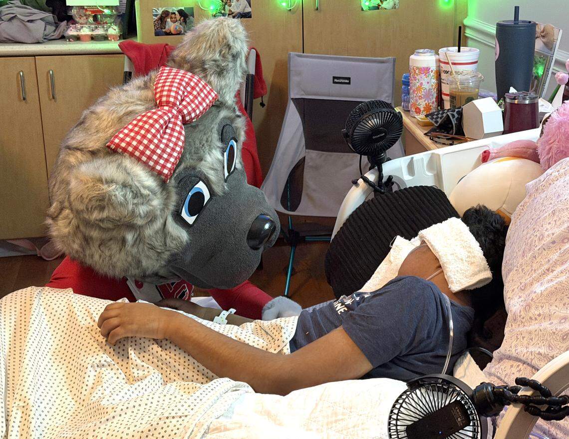 Ms. Wuf visits Grayson Ketchie at Transitions LifeCare Hospice Home in Raleigh, N.C., Wednesday, Feb. 11, 2026.