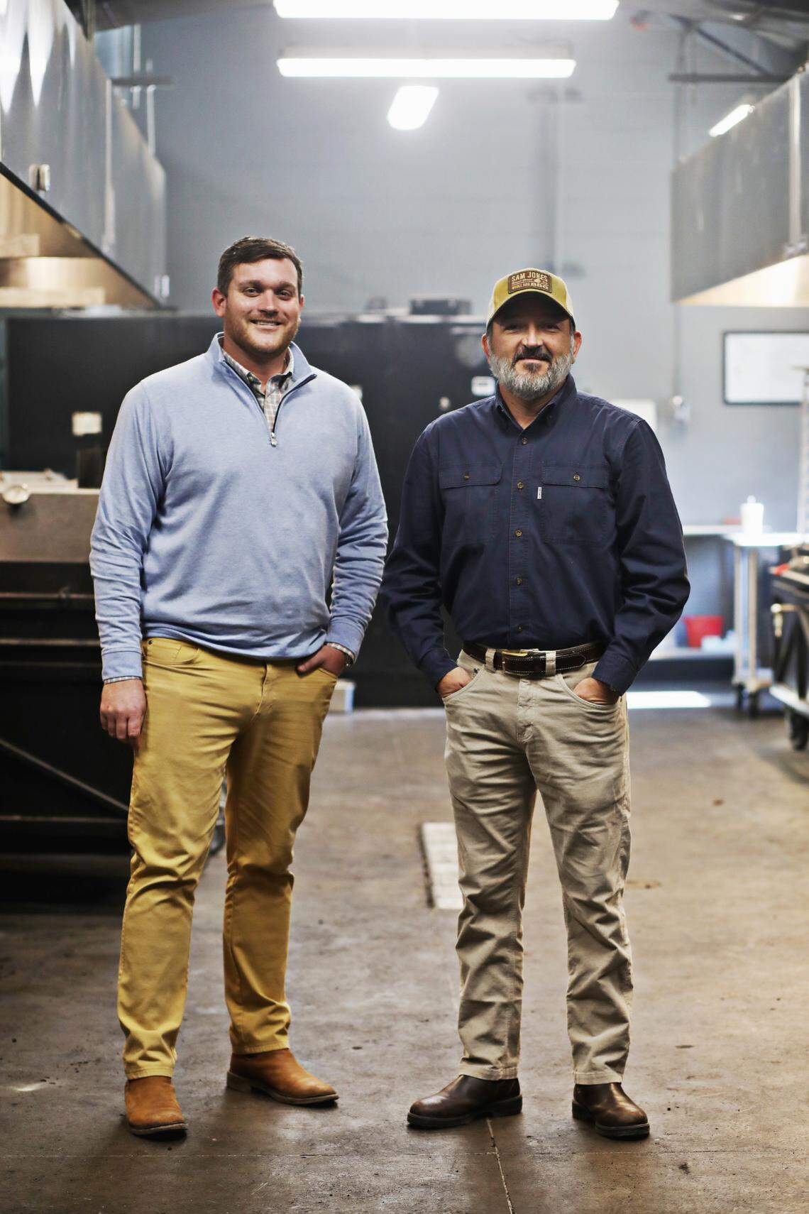 Partners Michael Letchworth, left, and Sam Jones, right, in the smokehouse at Sam Jones BBQ in downtown Raleigh, Wednesday, Feb. 3, 2021.