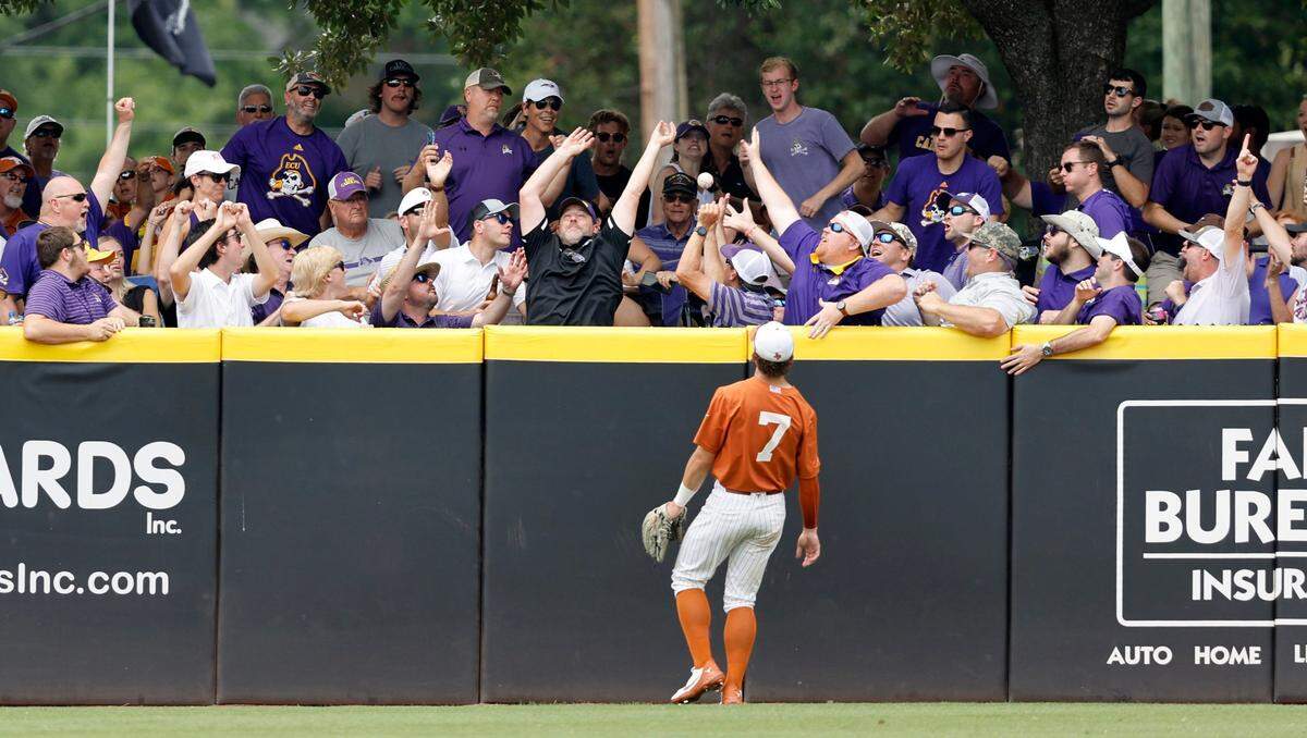 Texas’ Douglas Hodo (7) watches the homerun ball by East Carolina’s Bryson Worrell go over the wall during ECUs game against Texas in the Greenville Super Regional at Clark-LeClair Stadium Saturday, June 11, 2022.