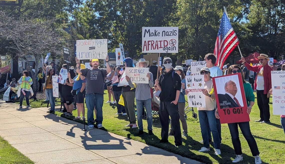 No Kings protesters gather in Clayton, N.C., Saturday, Oct. 18, 2025.