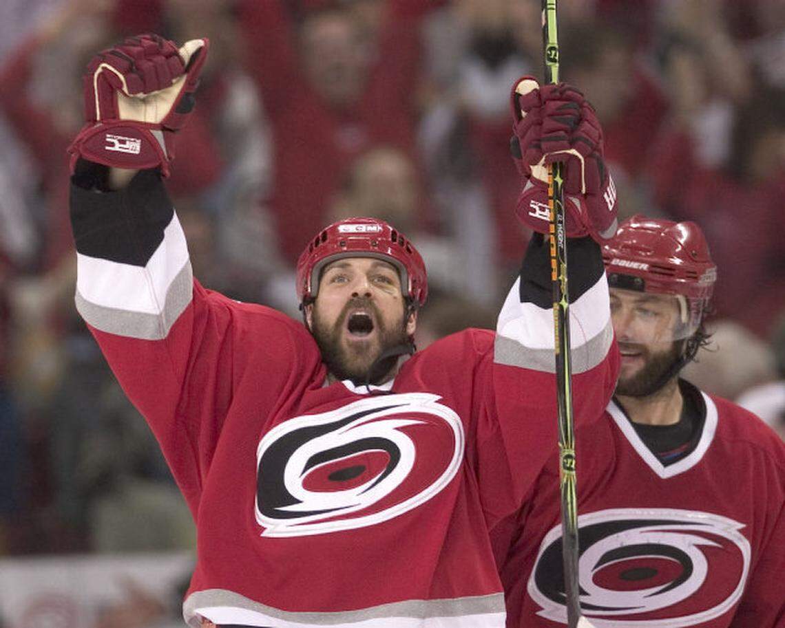 Carolina Hurricanes’ Doug Weight (39) celebrates with teammate Matt Cullen (8) as time expires, giving the Hurricanes a 4-2 victory and the Eastern Conference Championship on June 1, 2006, at the RBC Center.