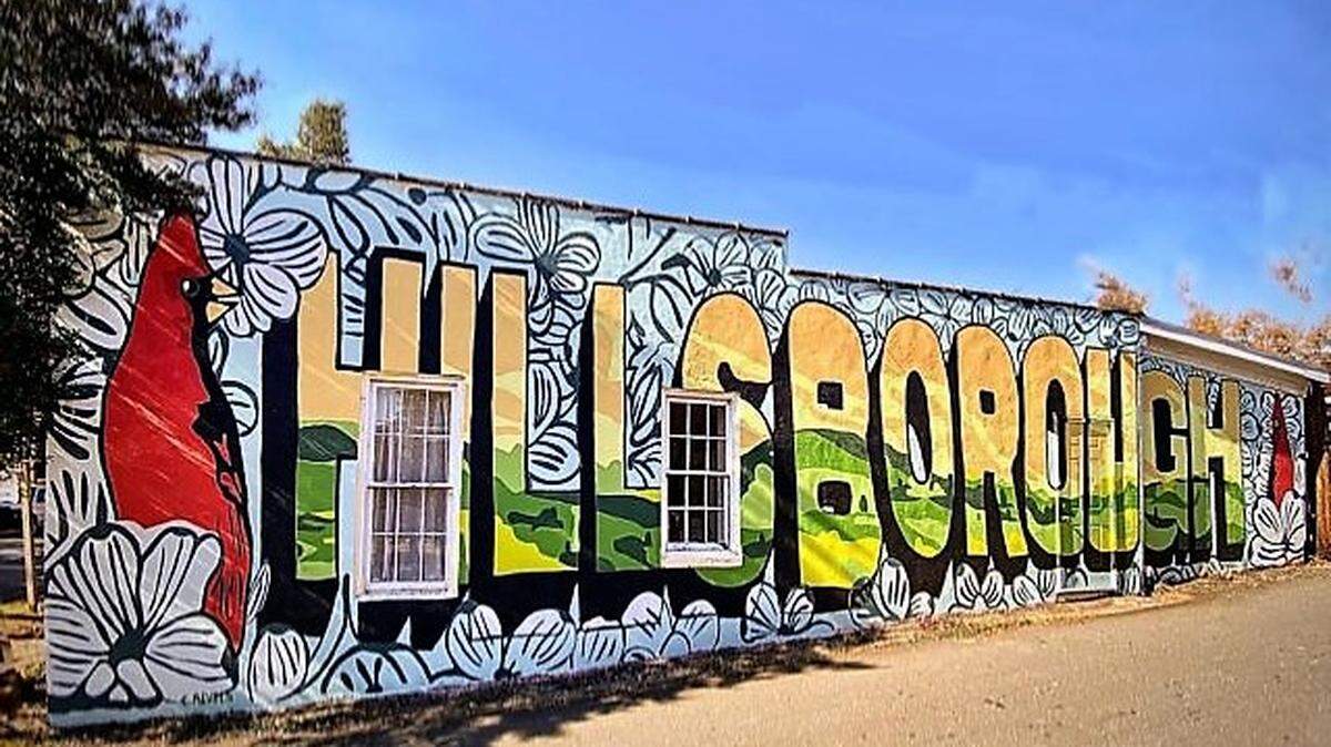 Artists Richard Nickel and Chris Revels painted this mural in 2021 on the side of The News of Orange at 109 E. King St. in downtown Hillsborough.
