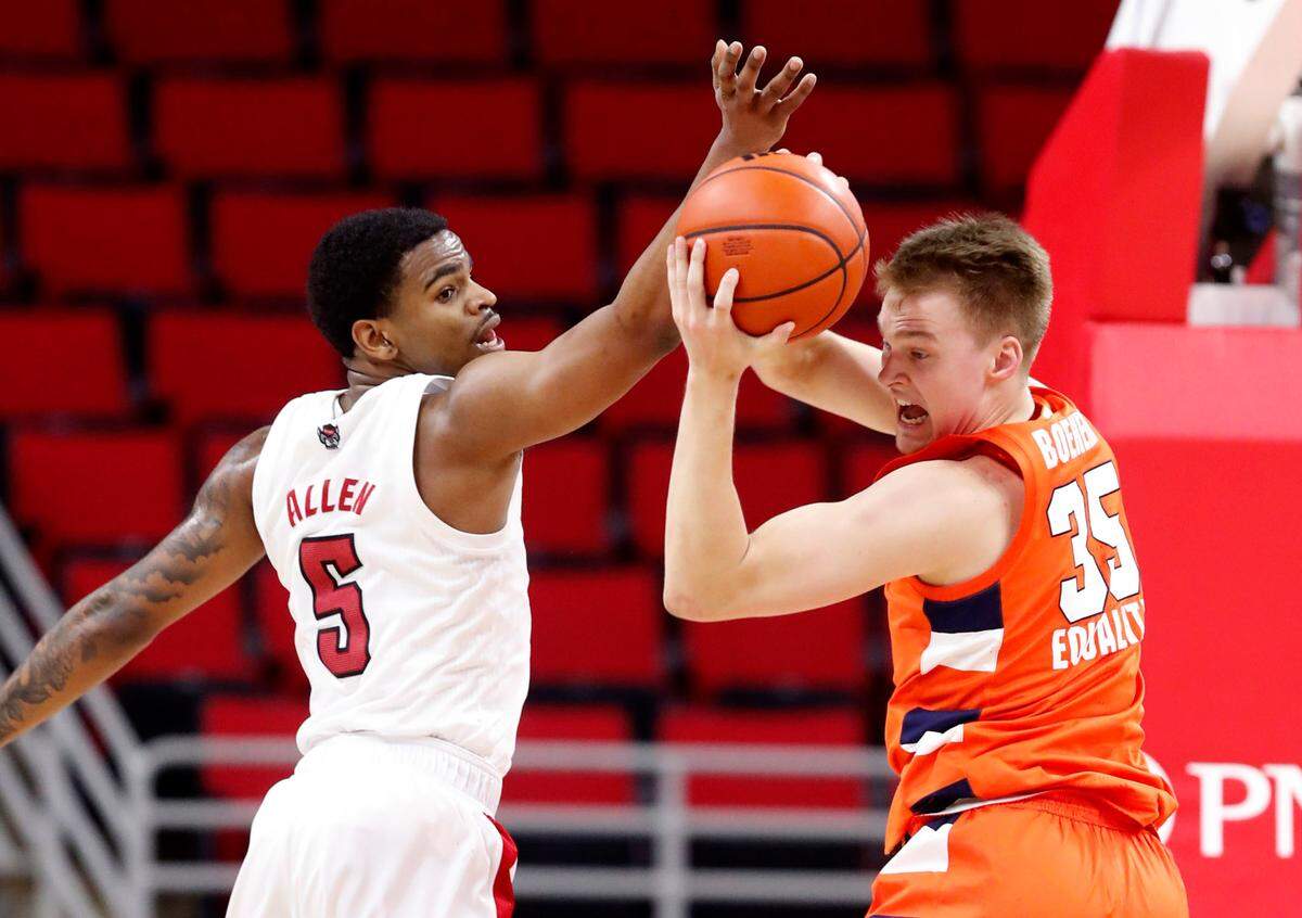 Syracuse’s Buddy Boeheim (35) pulls in the ball from N.C. State’s Thomas Allen (5) during the second half of Syracuse’s 77-68 victory over N.C. State at PNC Arena in Raleigh, N.C., Tuesday, February 9, 2021.