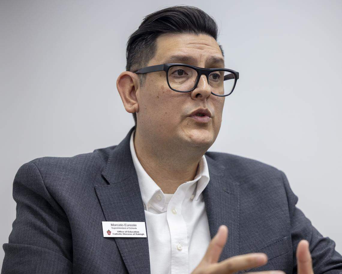 Marcelo Eureste, Superintendent of Schools for the Catholic Diocese of Raleigh, discusses how the North Carolina Opportunity Scholarships provide state-funded vouchers for K-12 students during an interview at St. Catherine of Siena Catholic School on Thursday, Feb. 12. 