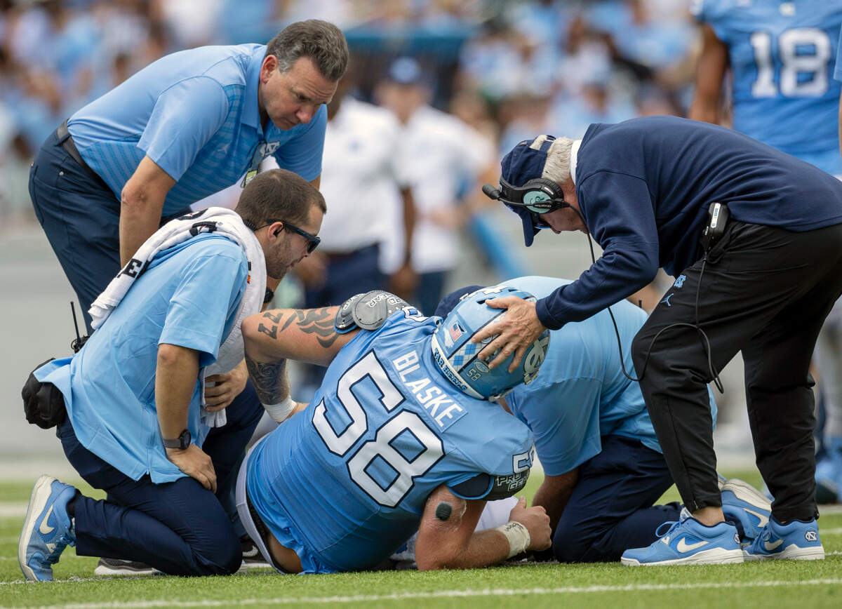 North Carolina coach Mack Brown checks on offensive lineman Austin Blaske (58) in the first half against Charlotte on Saturday, September 7, 2024 at Kenan Stadium in Chapel Hill, N.C.