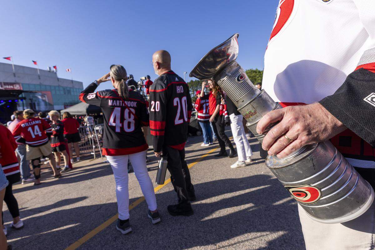 Carolina Hurricanes fans get ready for Game 1 of the Stanley Cup Final outside the Lenovo Center in Raleigh on Tuesday, June 2, 2026. For the first time since 2006, the Hurricanes are playing in the Stanley Cup Final, facing the Vegas Golden Knights, who won the Stanley Cup in 2023.