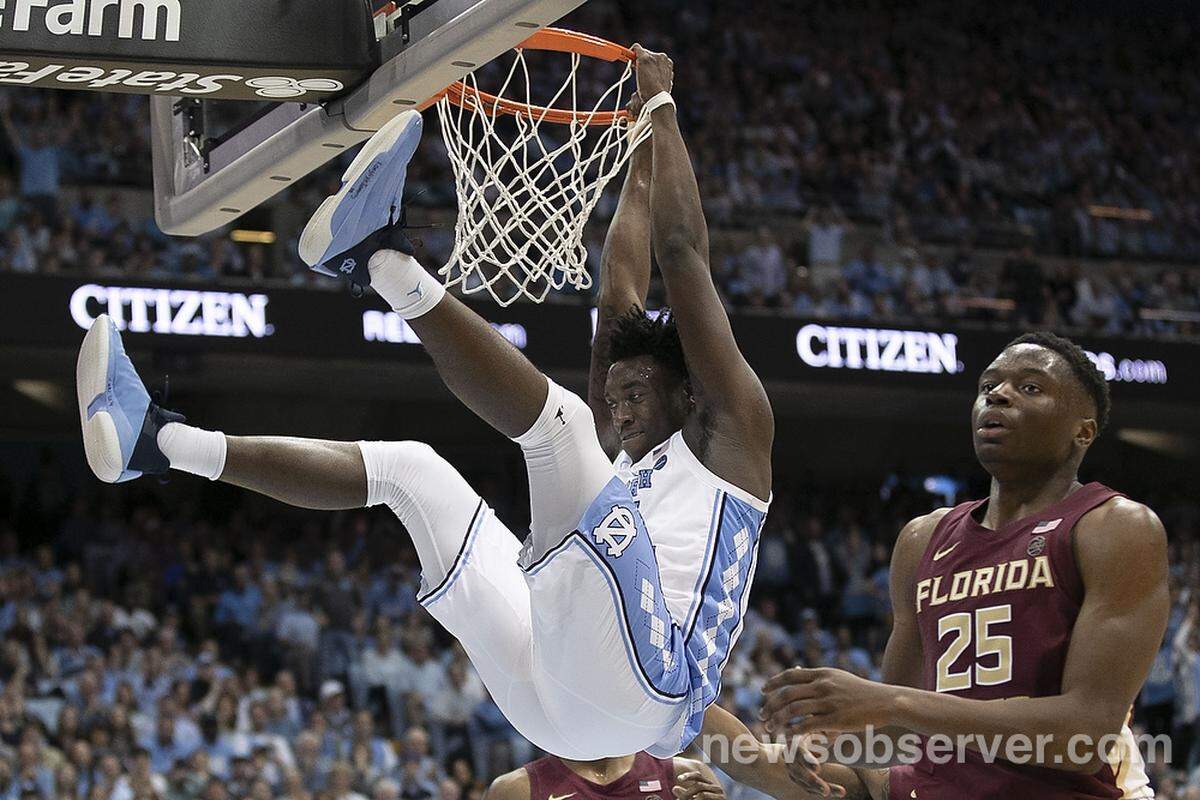 North Carolina’s Nassir Little (5) hangs on the rim after drawing a foul on a dunk attempt during the second half against Florida State on Saturday, February 23, 2019 at the Smith Center in Chapel Hill, N.C. Little lead North Carolina with 18 points in their 77-59 victory.