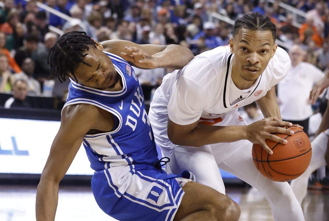 Miami’s Isaiah Wong fouls Duke’s Jeremy Roach during the first half of Duke’s game against Miami in the semifinals of the ACC Men’s Basketball Tournament in Greensboro, N.C., Friday, March 10, 2023.