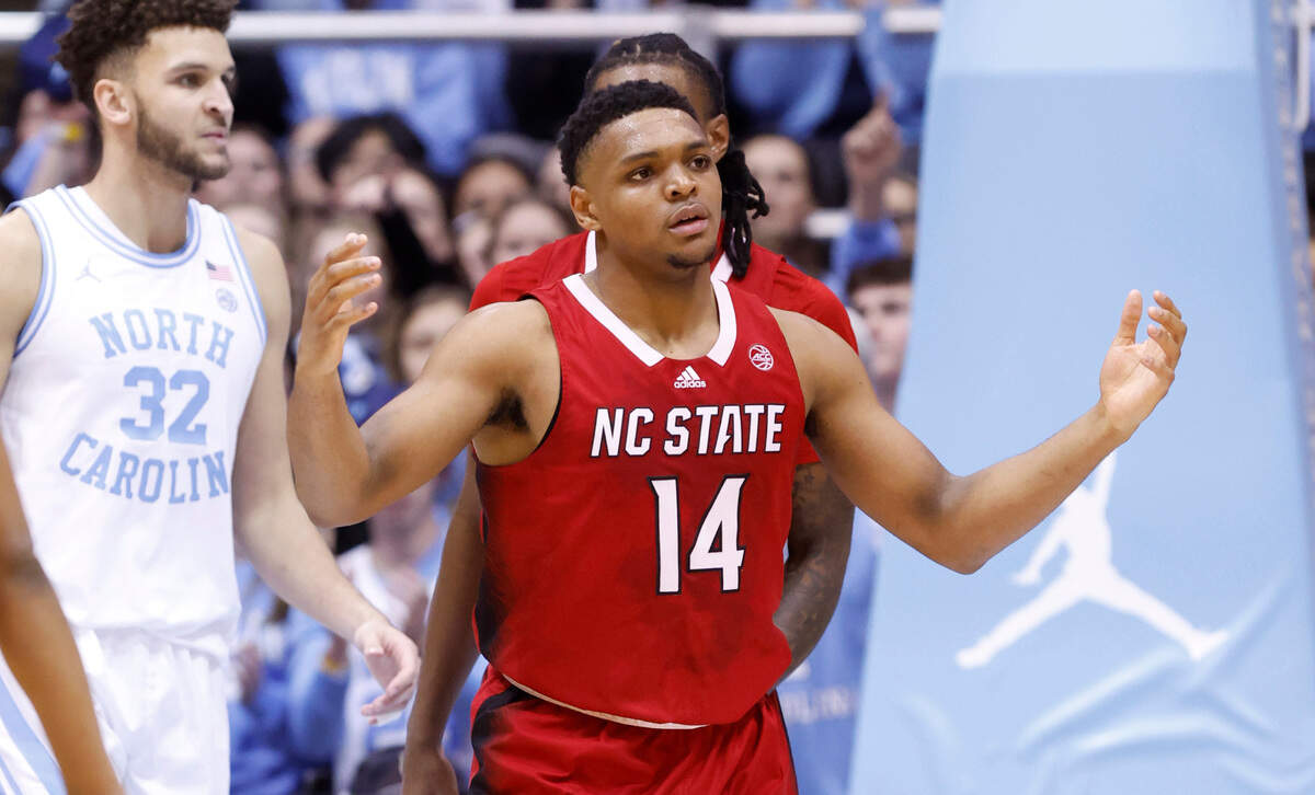 N.C. State’s Casey Morsell (14) reacts after he was called for a foul during the first half of N.C. State’s game against UNC at the Smith Center in Chapel Hill, N.C., Saturday, Jan. 21, 2023.