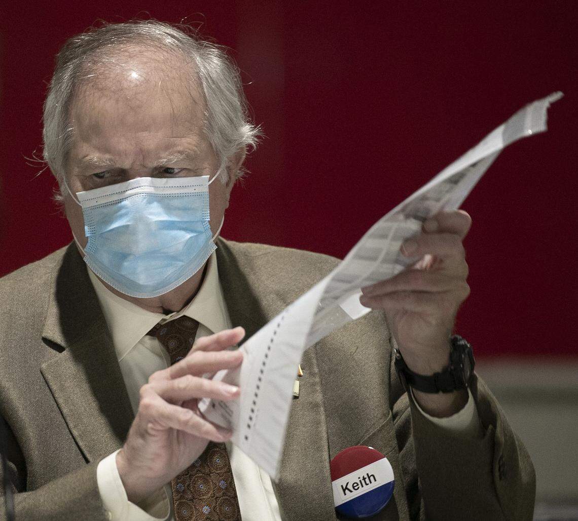 Wake County Board of Elections member Keith Weatherly reviews ballots on Friday, November 13, 2020 at the Wake County Board of Elections in Raleigh, N.C.