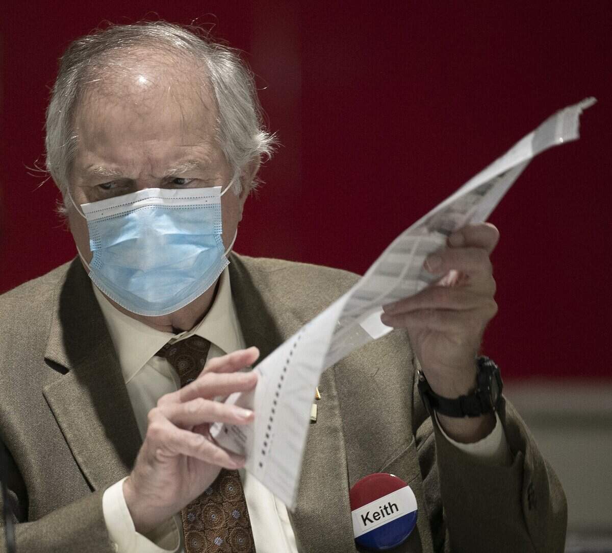 Wake County Board of Elections member Keith Weatherly reviews ballots on Friday, November 13, 2020 at the Wake County Board of Elections in Raleigh, N.C.