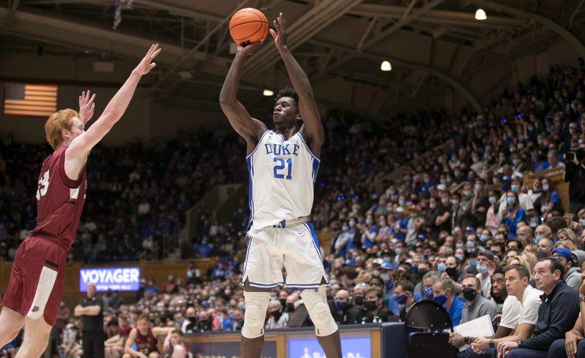 Duke’s A.J. Griffin (21) launches a three-point shot over Lafayette’s Leo O’Boyle (33) during the second half on Friday, November 19, 2021 at Cameron Indoor Stadium in Durham, N.C. Griffin scored 18 points in the Blue Devils’ 88-55 victory.